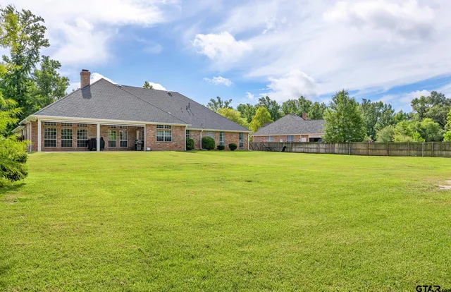 a view of a house with a big yard