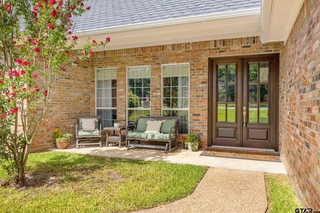 a view of swimming pool with outdoor seating