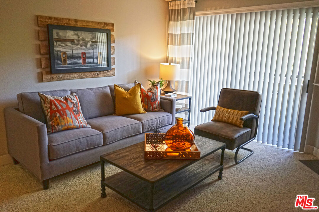 151 East Holly Street, Unit 2201 Pasadena, CA 91103 - Photo 2 of 33 a living room with furniture and a window