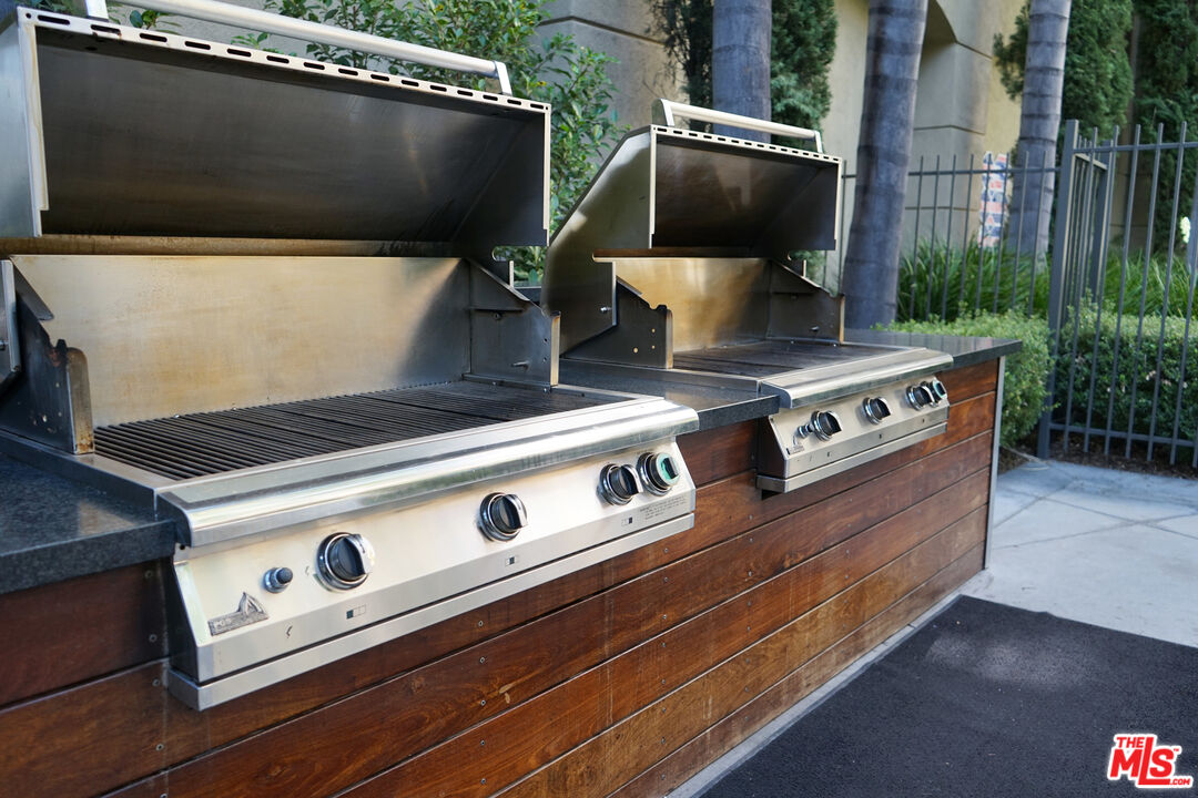 151 East Holly Street, Unit 2201 Pasadena, CA 91103 - Photo 32 of 33 a stove top oven sitting inside of a kitchen