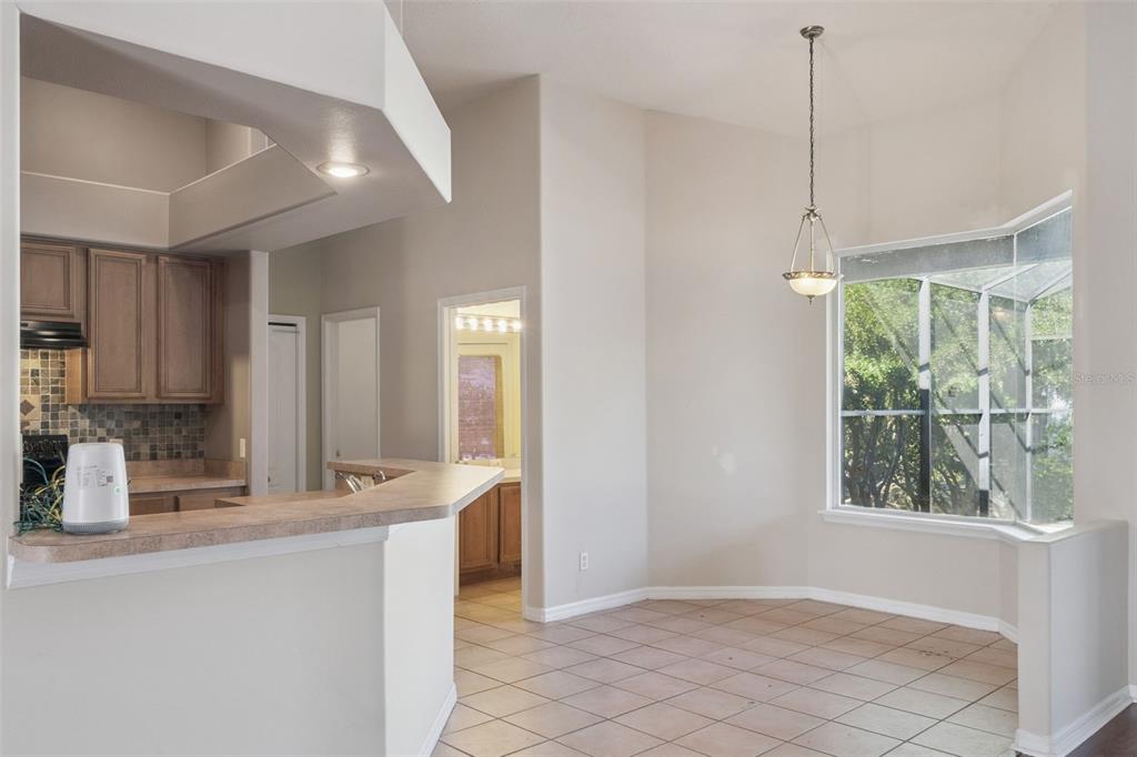 774 Lancer Circle Ocoee, FL 34761 - Photo 13 of 35 a kitchen with stainless steel appliances granite countertop a sink and a refrigerator
