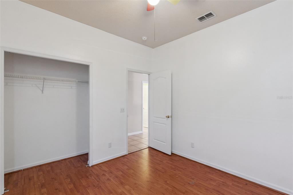 774 Lancer Circle Ocoee, FL 34761 - Photo 16 of 35 a view of an empty room with wooden floor and a window