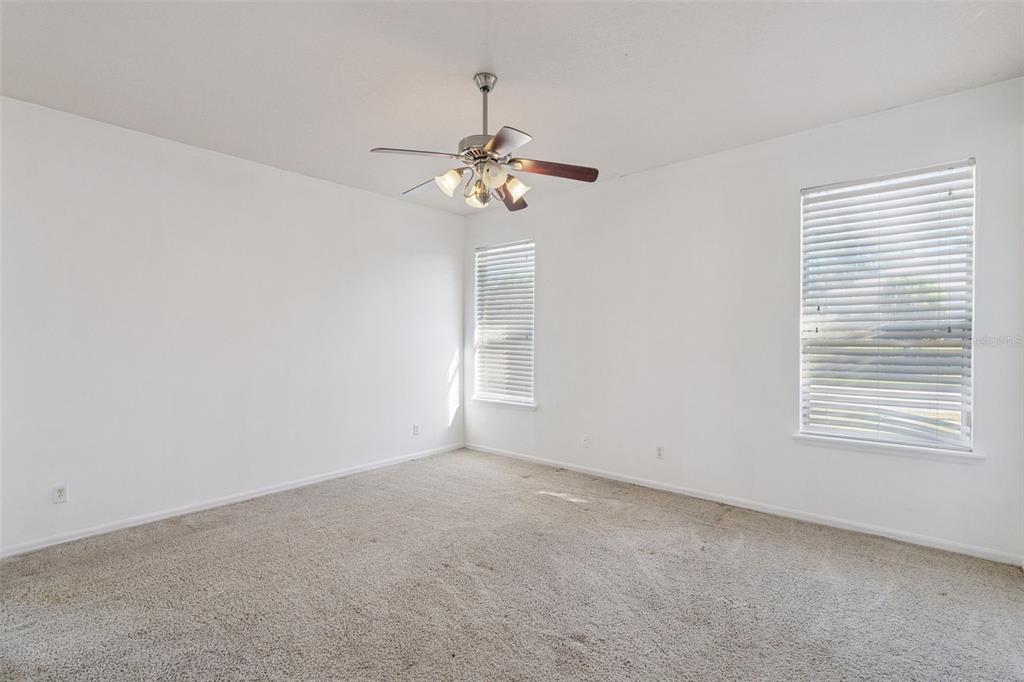 774 Lancer Circle Ocoee, FL 34761 - Photo 22 of 35 a view of a livingroom with a ceiling fan and window
