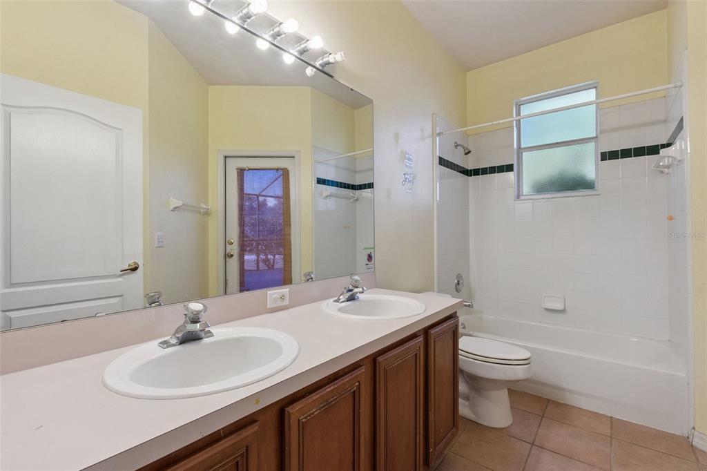 774 Lancer Circle Ocoee, FL 34761 - Photo 25 of 35 a bathroom with a sink and a mirror