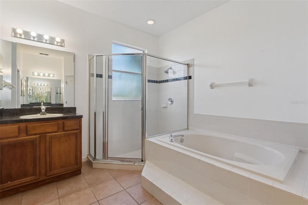 774 Lancer Circle Ocoee, FL 34761 - Photo 26 of 35 a bathroom with a bathtub and a shower