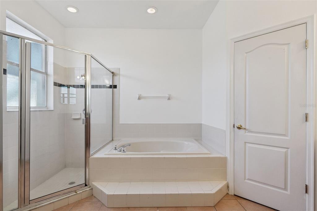 774 Lancer Circle Ocoee, FL 34761 - Photo 28 of 35 a bathroom with a tub and shower