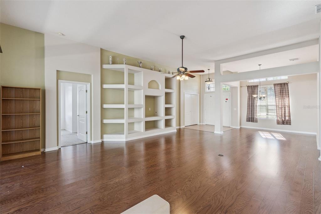 774 Lancer Circle Ocoee, FL 34761 - Photo 5 of 35 a view of an empty room with wooden floor and a window
