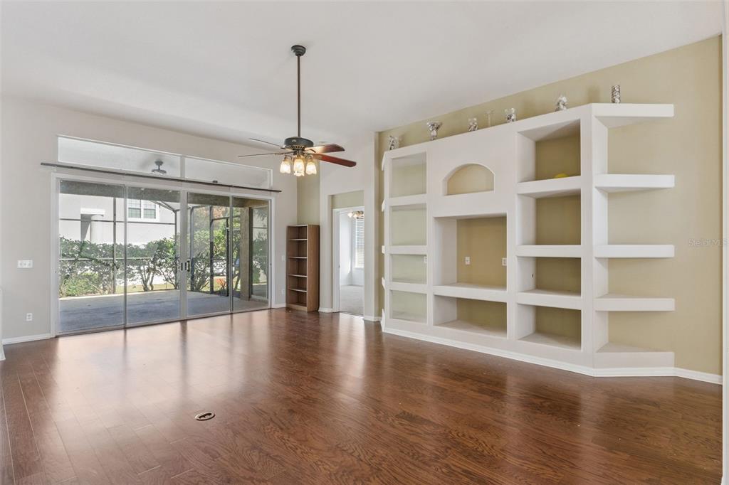 774 Lancer Circle Ocoee, FL 34761 - Photo 6 of 35 a view of an empty room with a window and wooden floor