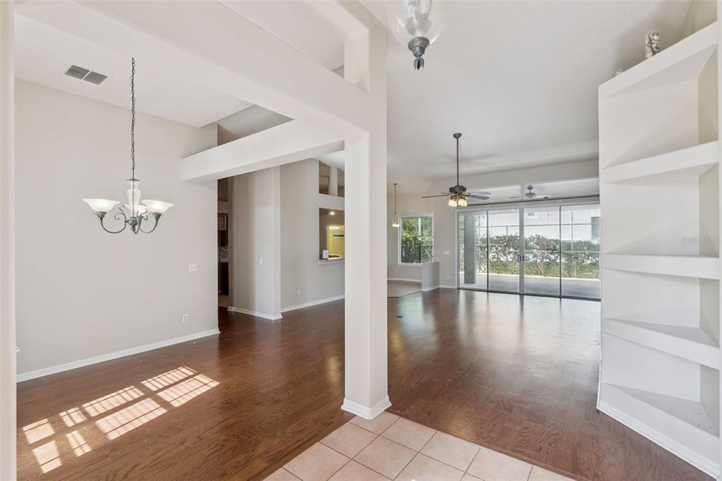 774 Lancer Circle Ocoee, FL 34761 - Photo 8 of 35 a view interior of the house and livingroom with furniture wooden floor a chandelier