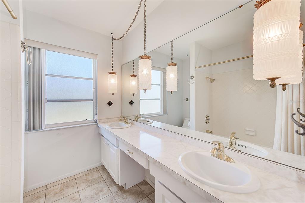 4908 Commonwealth Road Palmetto, FL 34221 - Photo 8 of 15 a bathroom with a double vanity sink mirror and double