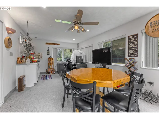 a dining room with furniture and window