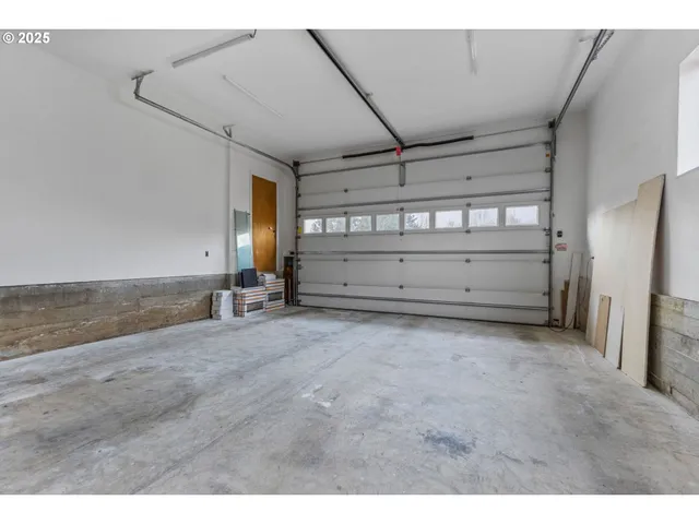 a view of kitchen and refrigerator