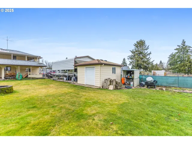 an aerial view of a house with outdoor space swimming pool