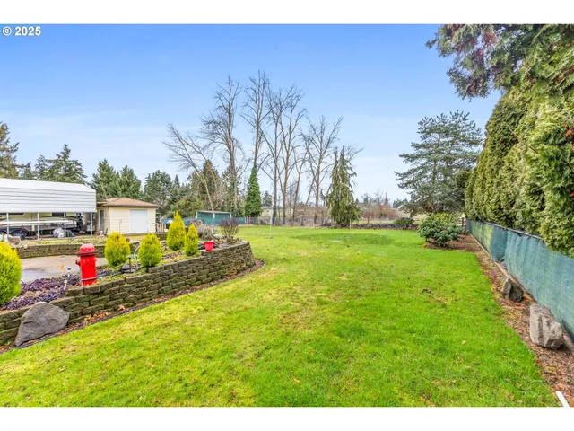 a view of swimming pool with outdoor seating and yard