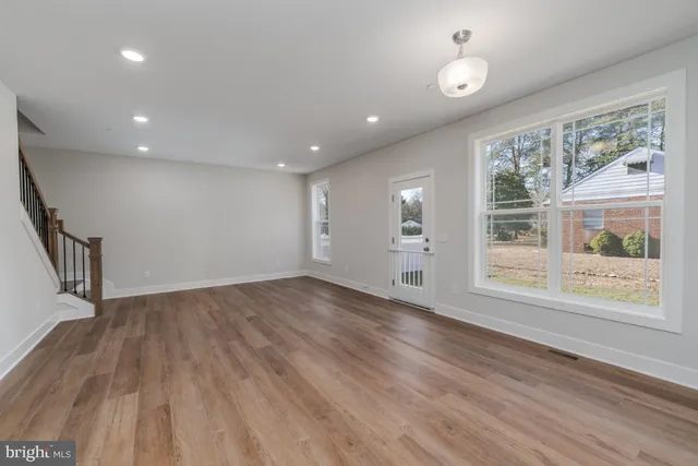 a view of kitchen with kitchen island and stainless steel appliances
