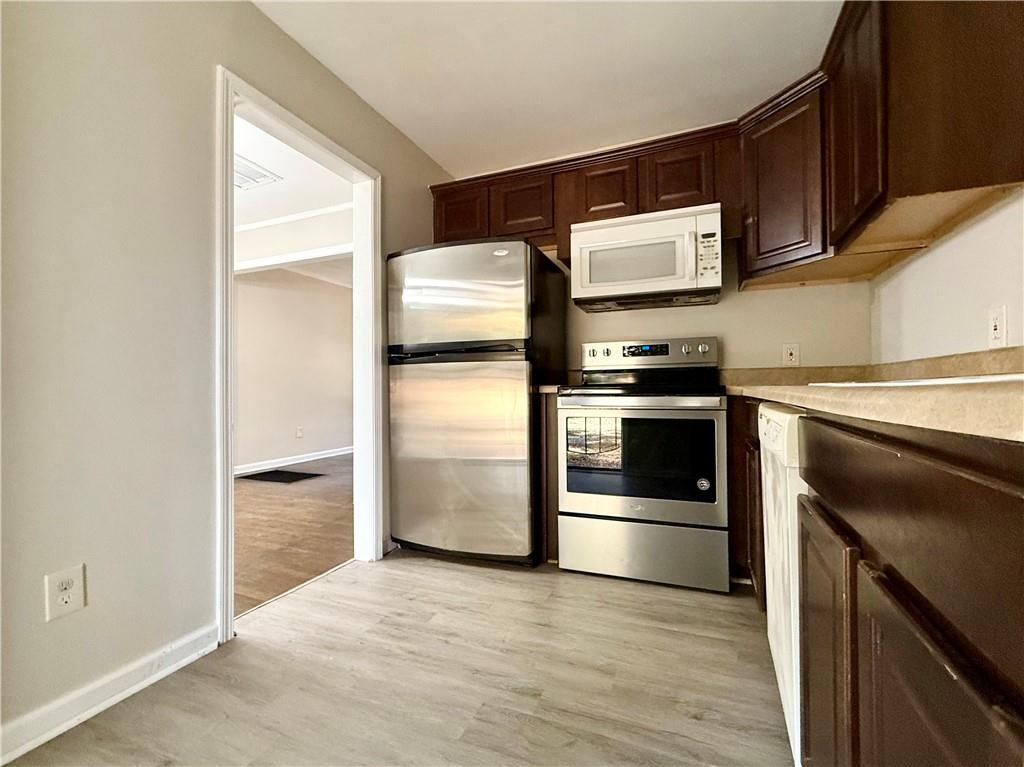 1910 Wildwood Drive Decatur, GA 30032 - Photo 11 of 17 a kitchen with a stove and a refrigerator