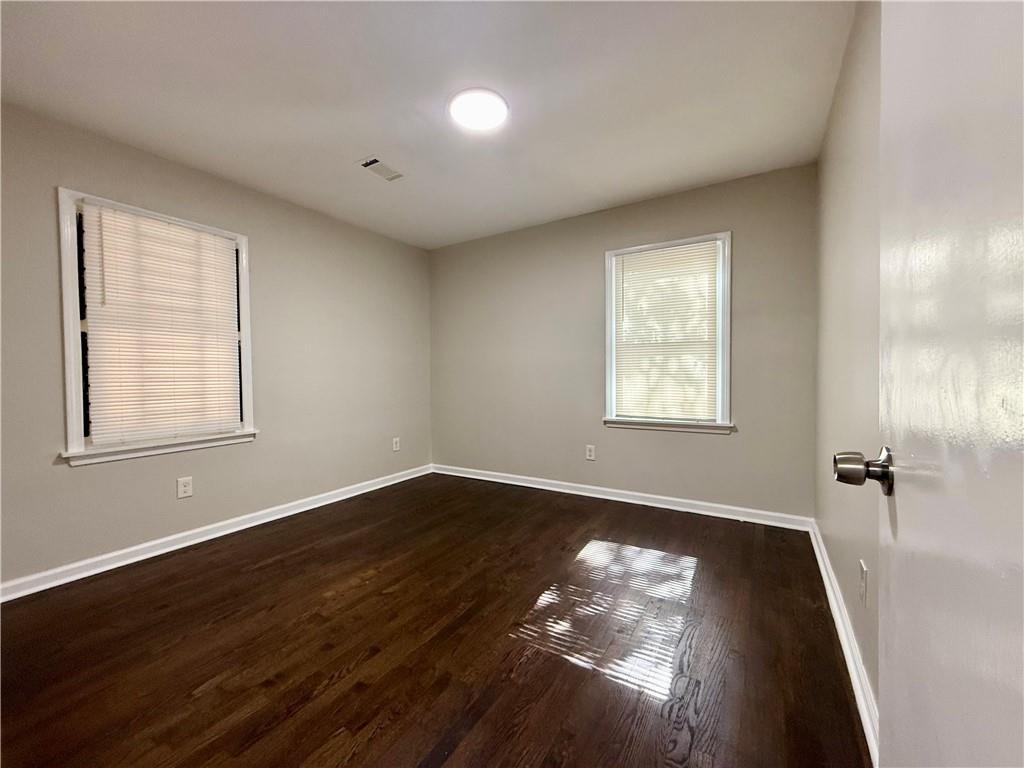 1910 Wildwood Drive Decatur, GA 30032 - Photo 8 of 17 a view of empty room with wooden floor and fan