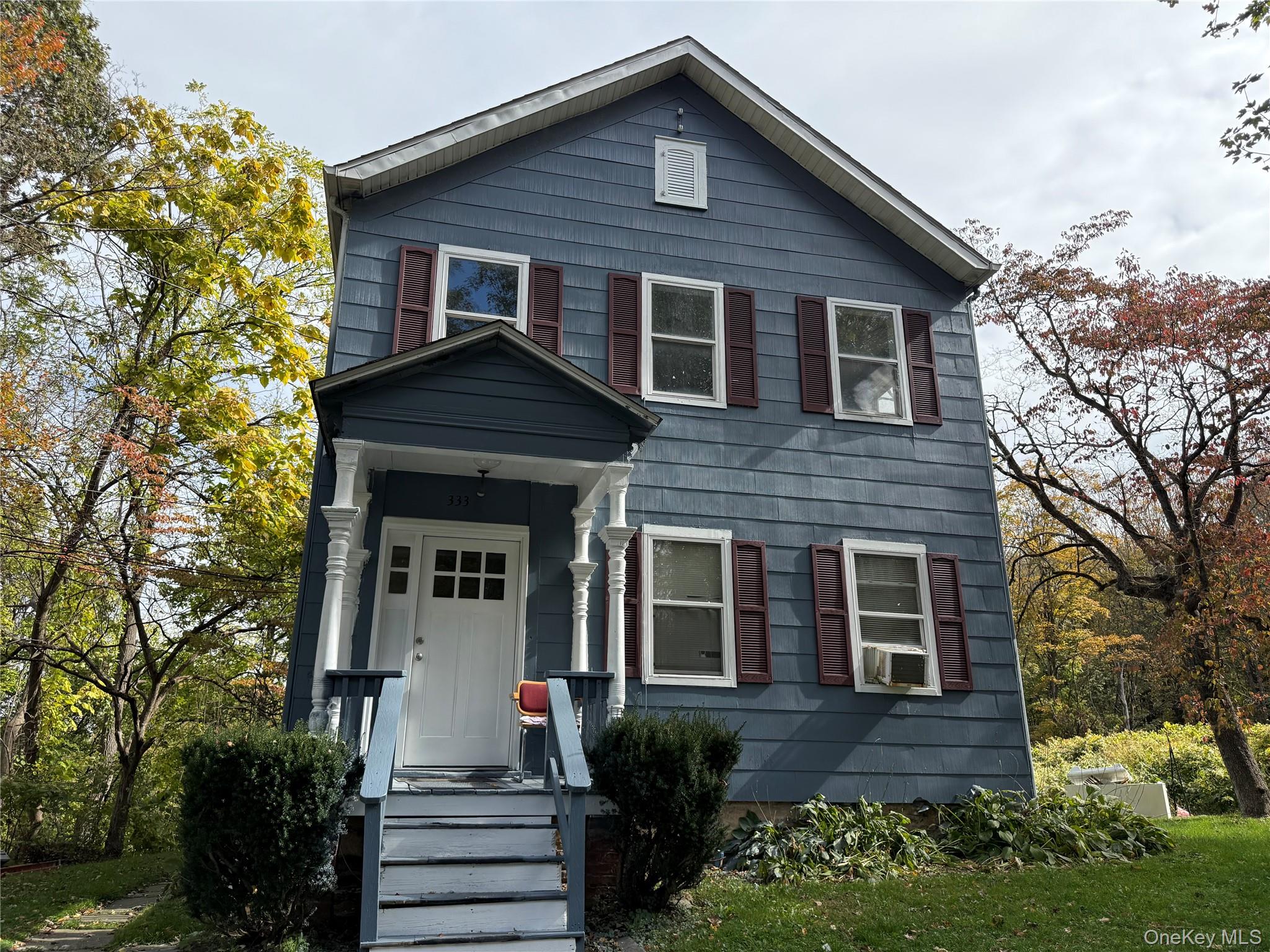 a front view of a house with a yard