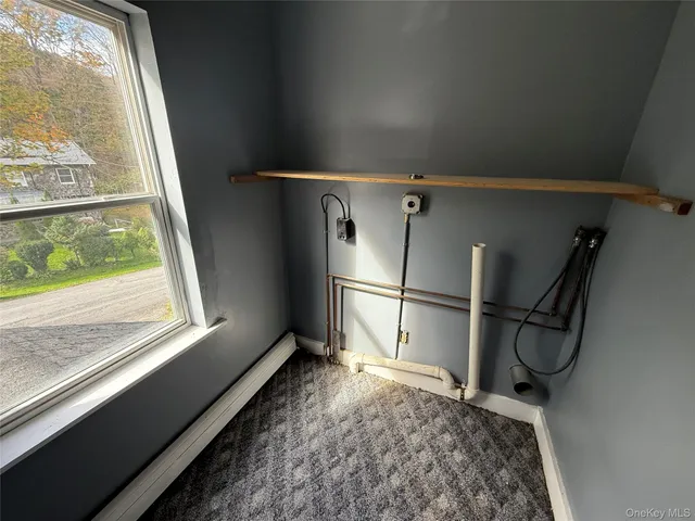 a storage & utility room with a window