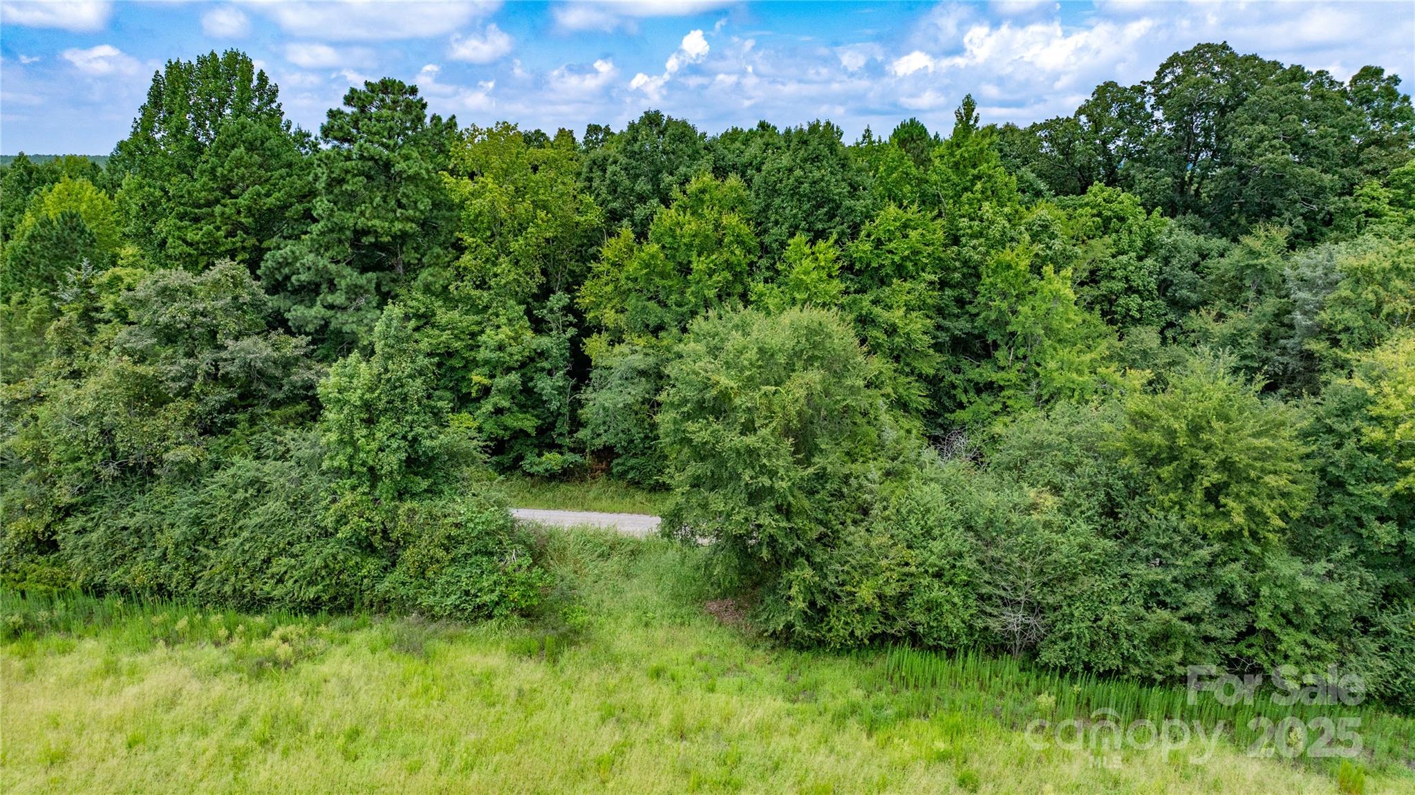 0 Daystar Road, Unit 16 Lancaster, SC 29720 - Photo 18 of 20 a view of a garden with a building in the background