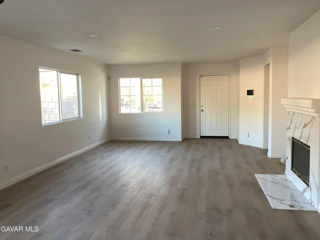 a view of livingroom with furniture and fireplace