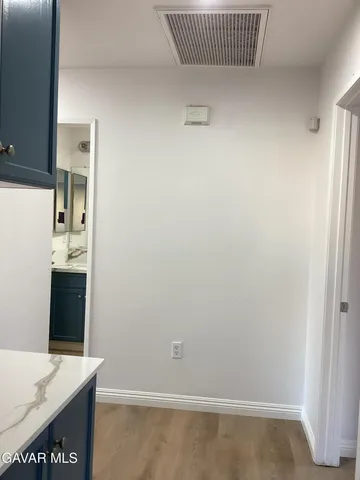 a bathroom with a sink a vanity and a window