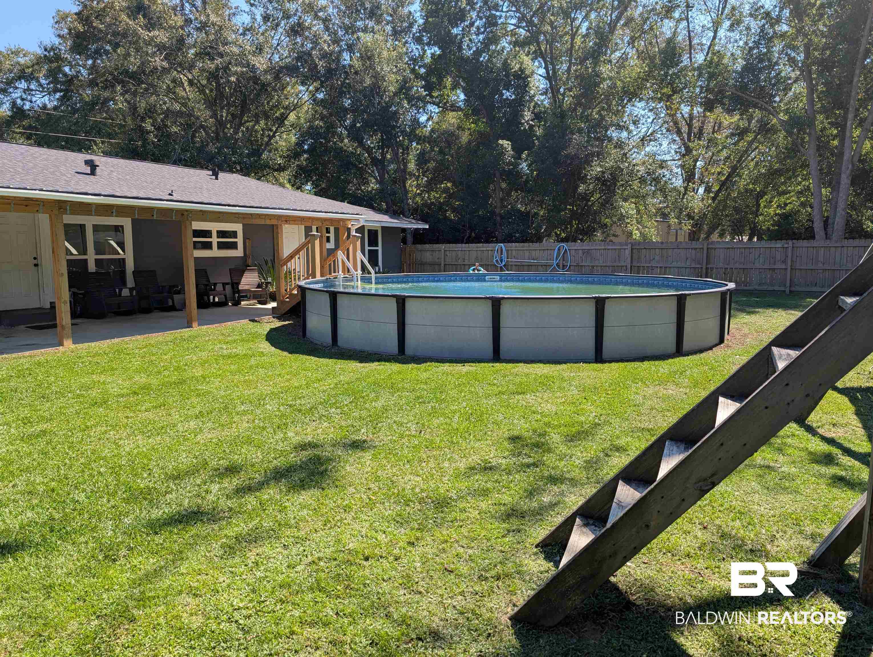 22103 2nd Street Silverhill, AL 36576 - Photo 5 of 10 View of yard with a patio and a fenced in pool