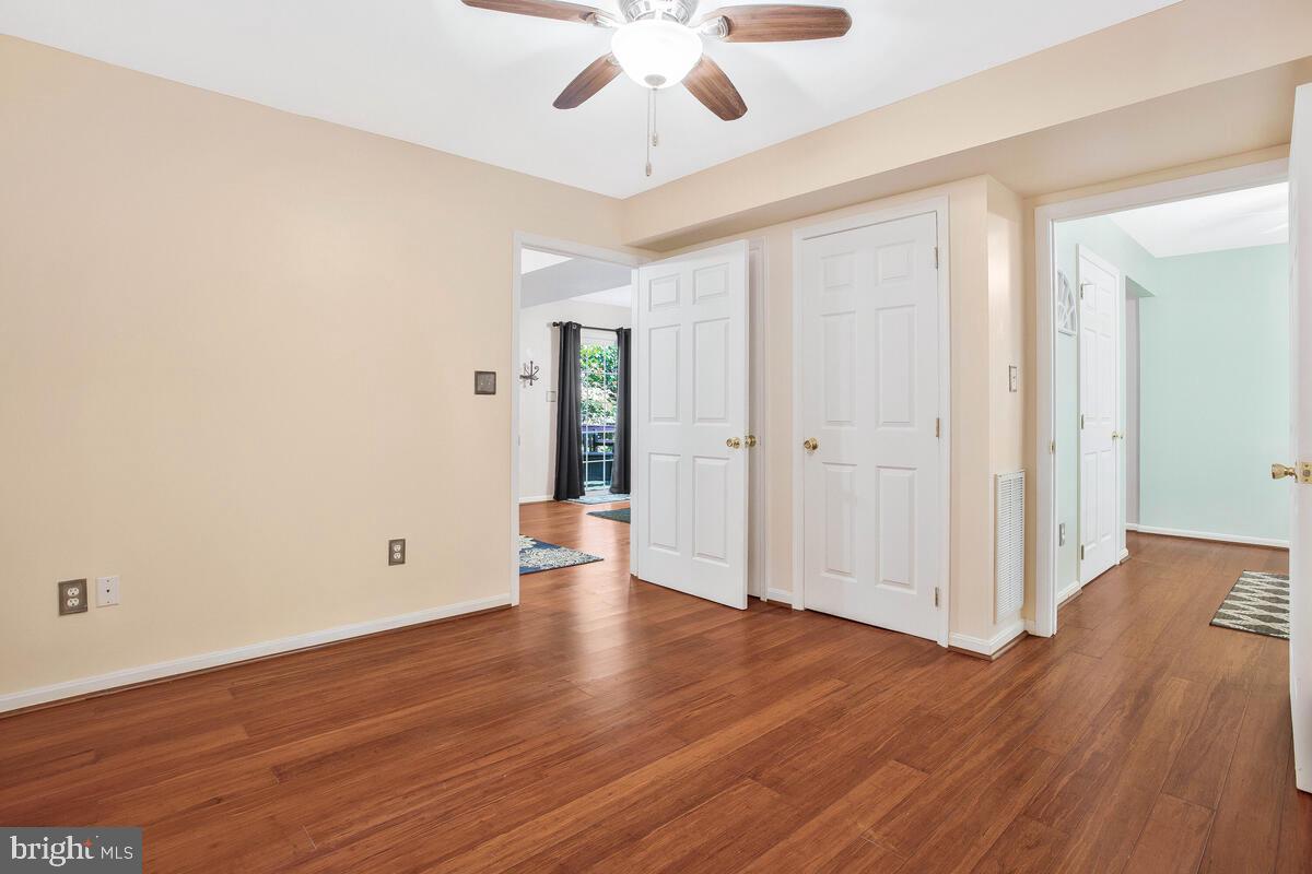 165 Ball Road St. Leonard, MD 20685 - Photo 45 of 55 a view of an empty room with wooden floor