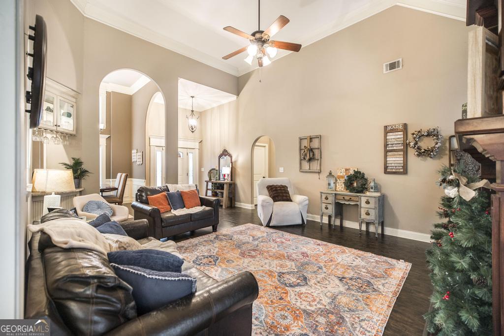 312 Bridgehampton Way Perry, GA 31069 - Photo 11 of 34 a living room with furniture potted plant and a large window