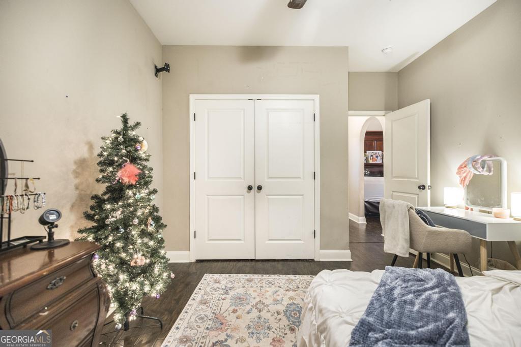 312 Bridgehampton Way Perry, GA 31069 - Photo 23 of 34 a bedroom with a bed and a chandelier