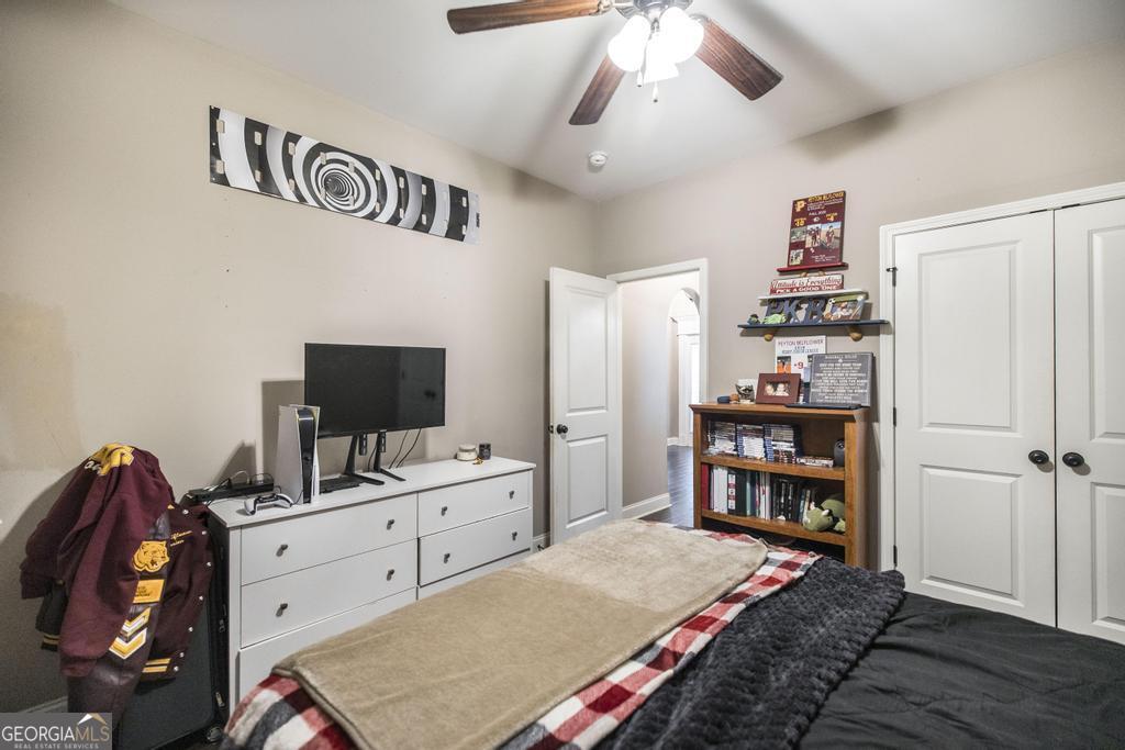 312 Bridgehampton Way Perry, GA 31069 - Photo 26 of 34 a bedroom with a bed and a flat tv screen on the table