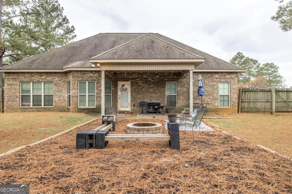 312 Bridgehampton Way Perry, GA 31069 - Photo 30 of 34 a front view of a house with a outdoor seating