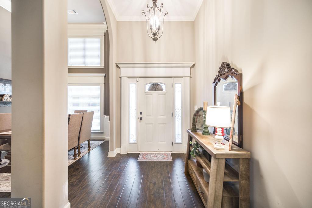 312 Bridgehampton Way Perry, GA 31069 - Photo 7 of 34 a view of a hallway with wooden floor and workspace