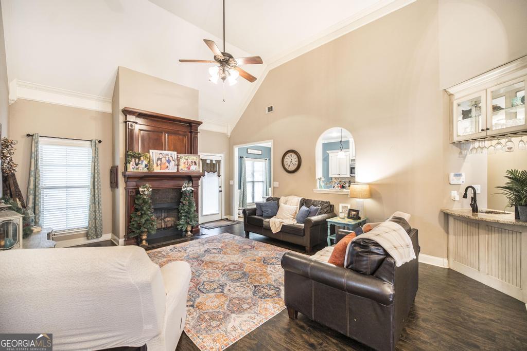 312 Bridgehampton Way Perry, GA 31069 - Photo 9 of 34 a living room with fireplace furniture and a chandelier