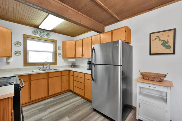 a kitchen with appliances cabinets and a sink