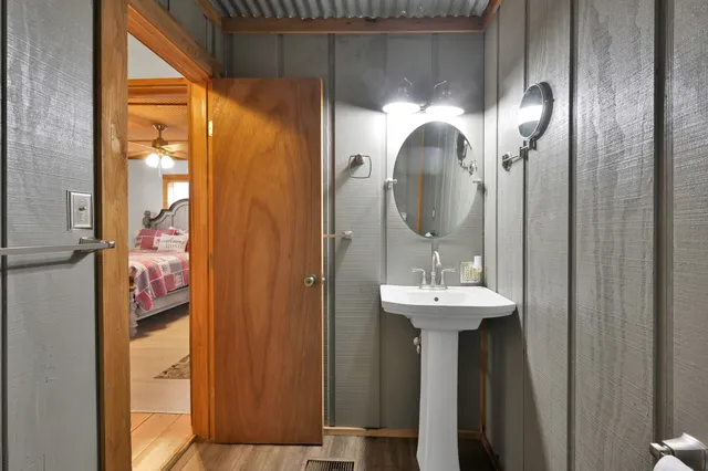 a bathroom with a sink and a mirror
