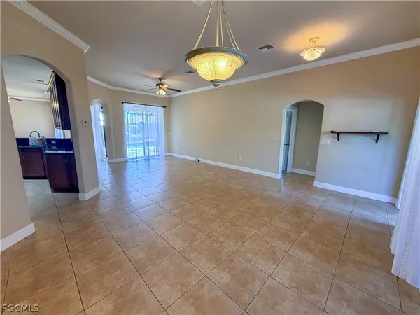 a view of a hallway with a chandelier