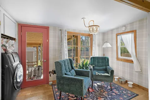 a living room with furniture and a window