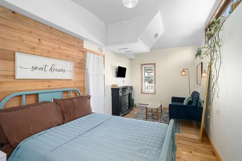 a bedroom with a bed and furniture