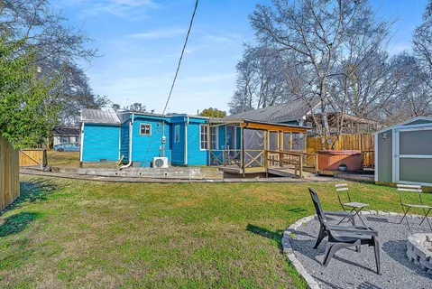 a view of a house with swimming pool and porch with furniture