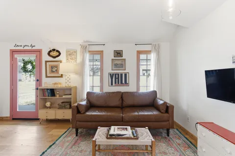 a view of a house with swimming pool and sitting area