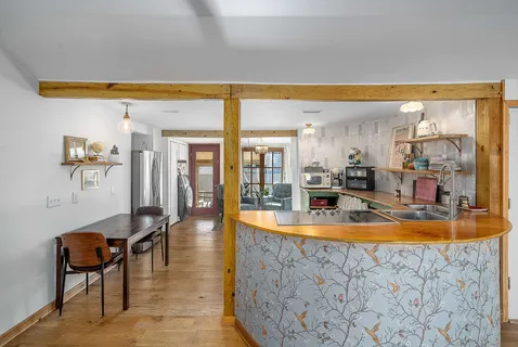 a view of a living room and dining room