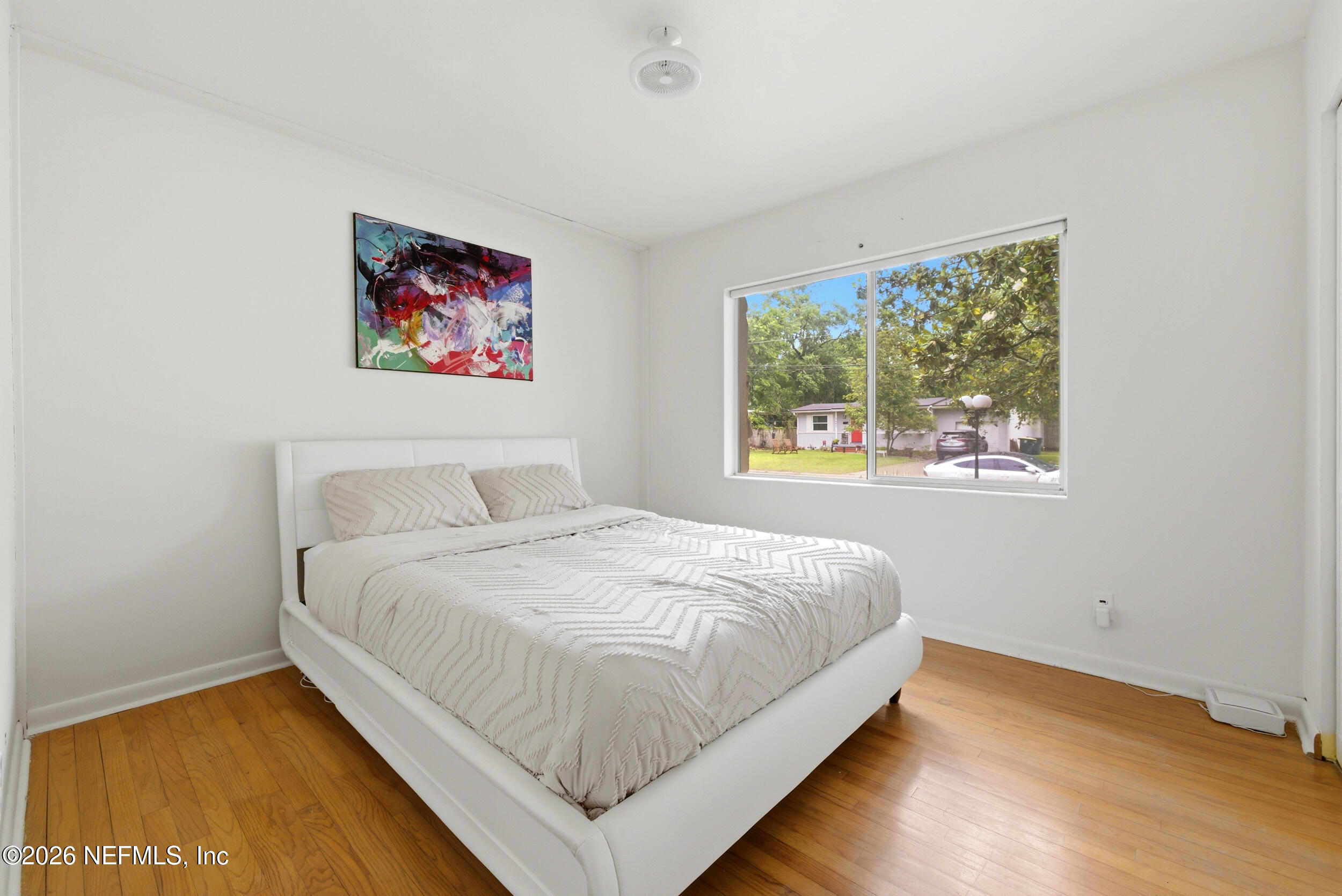 7484 Spinola Road Jacksonville, FL 32217 - Photo 35 of 63 a large bed sitting in a bedroom next to a window