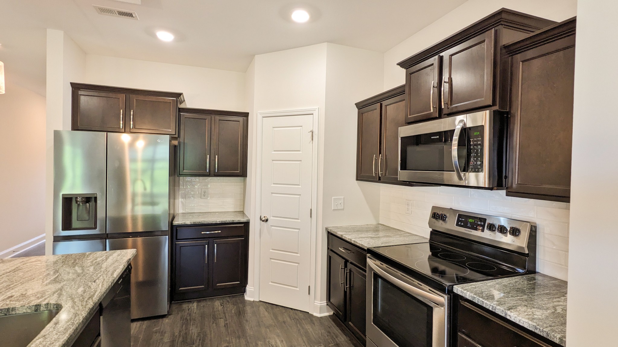 602 Alvin Road Clarksville, TN 37042 - Photo 14 of 39 a kitchen with stainless steel appliances granite countertop a stove microwave and sink