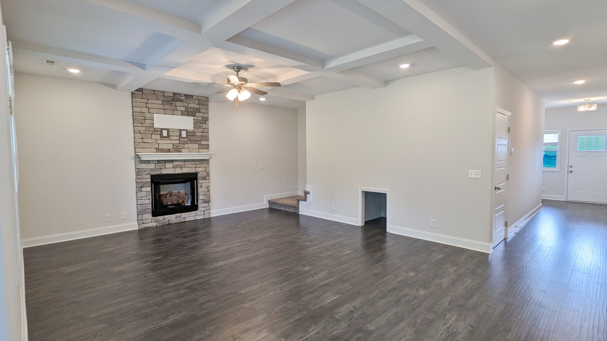 602 Alvin Road Clarksville, TN 37042 - Photo 10 of 39 an empty room with wooden floor and fireplace