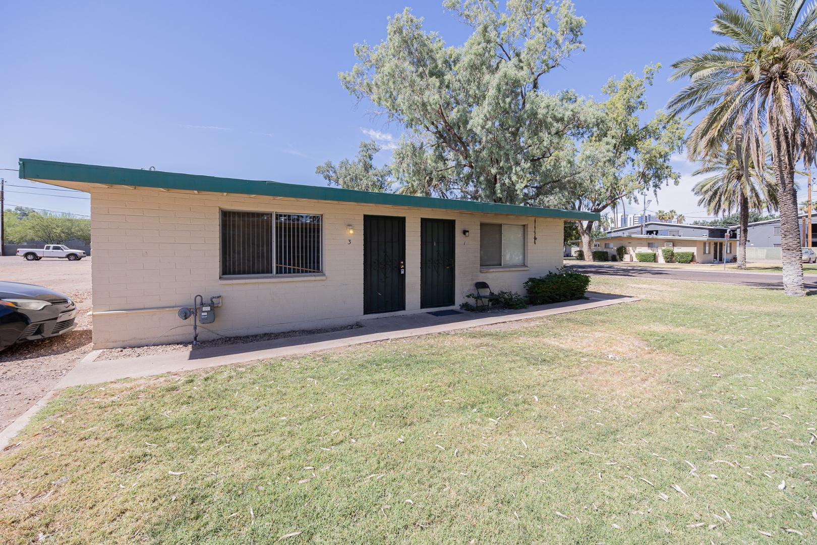 1017 South Mariana Street, Unit 3 Tempe, AZ 85281 - Photo 1 of 9 a house with swimming pool in front of it
