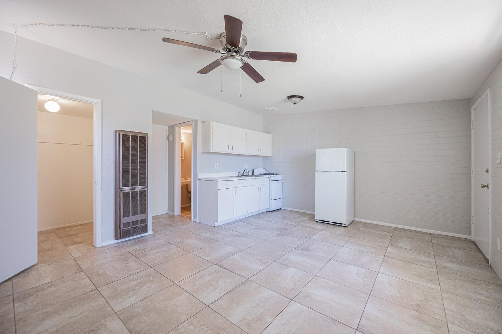 1017 South Mariana Street, Unit 3 Tempe, AZ 85281 - Photo 5 of 9 a view of a kitchen with a sink and a refrigerator