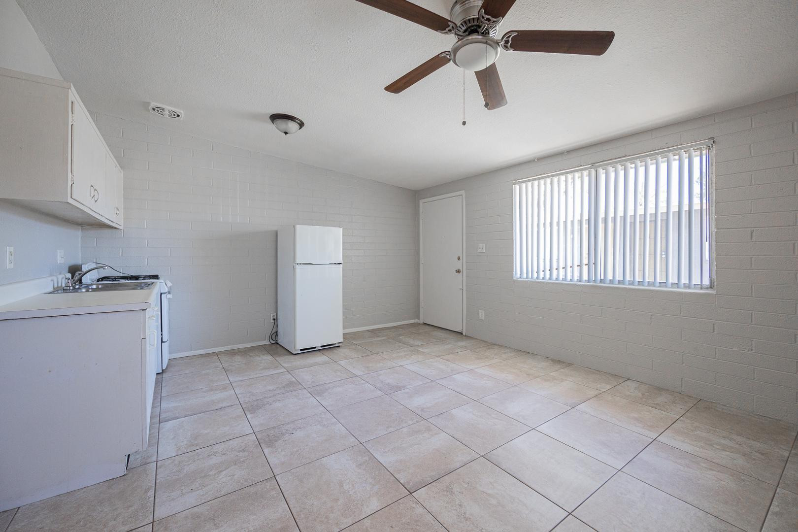1017 South Mariana Street, Unit 3 Tempe, AZ 85281 - Photo 6 of 9 a view of an empty room with a window