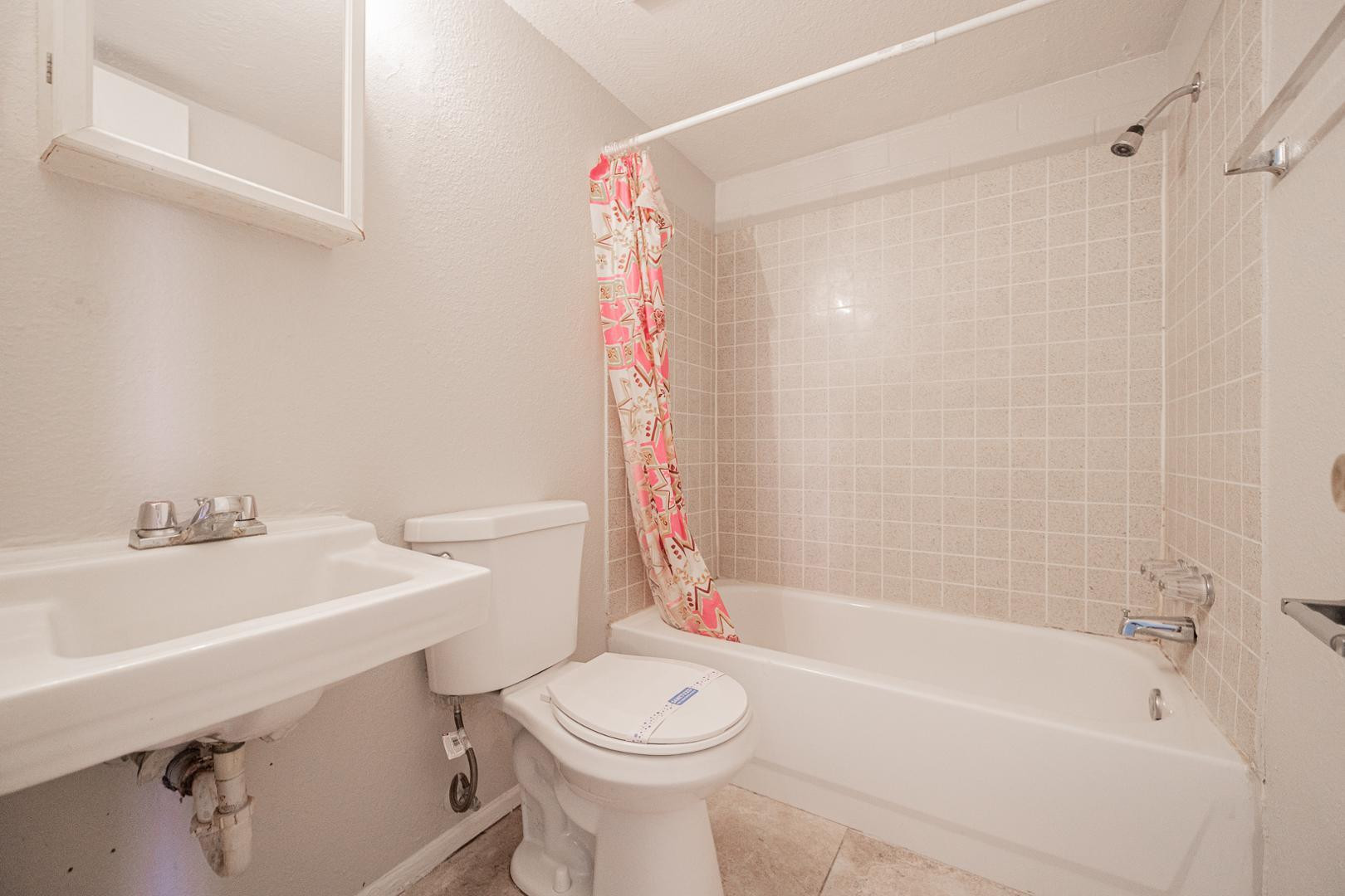 1017 South Mariana Street, Unit 3 Tempe, AZ 85281 - Photo 9 of 9 a bathroom with a sink a toilet and a bathtub