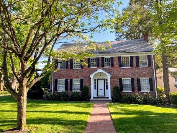 a front view of a house with yard